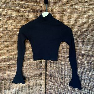 PrettyLittleThing cropped turtle neck with flared sleeves!